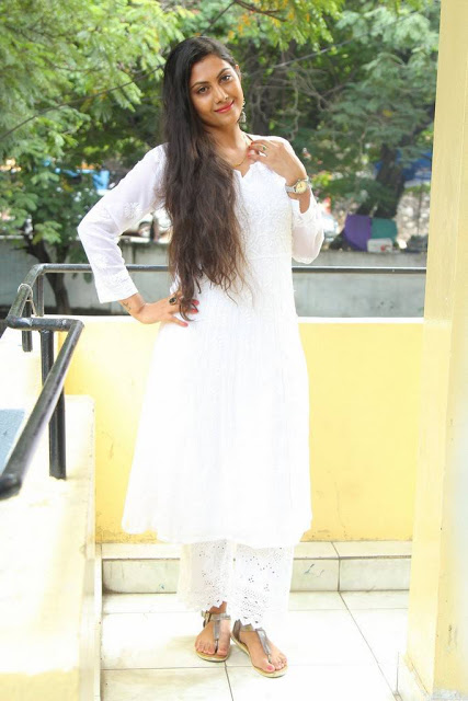 Television Actress Priyanka Naidu Long hair Stills In White Dress 15